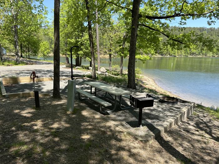 A photo of Site 13 of Loop A at Crystal Springs (AR) with Picnic Table, Electricity Hookup, Fire Pit, Tent Pad, Water Hookup