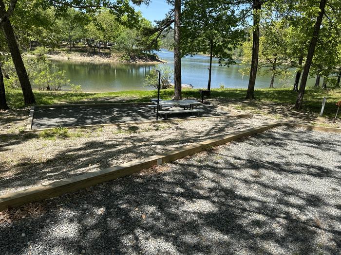 A photo of Site 18 of Loop A at Crystal Springs (AR) with Picnic Table, Electricity Hookup, Fire Pit, Tent Pad, Lantern Pole, Water Hookup