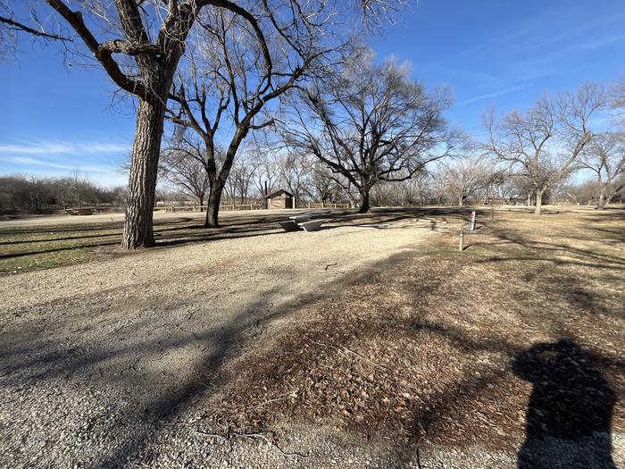 A photo of Site 026 of Loop RIVE at RIVERSIDE (KS) with Picnic Table, Electricity Hookup, Fire Pit, Shade, Water Hookup