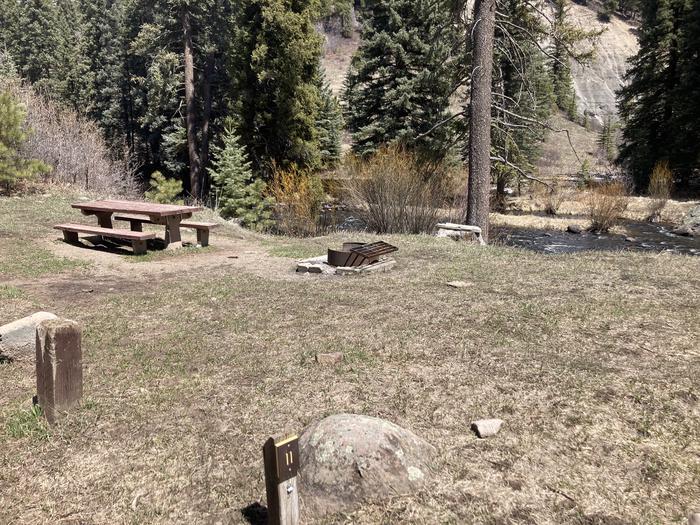 A photo of Site 11 of Loop F at WILLIAMS CREEK CAMPGROUND with Picnic Table, Fire Pit, Waterfront