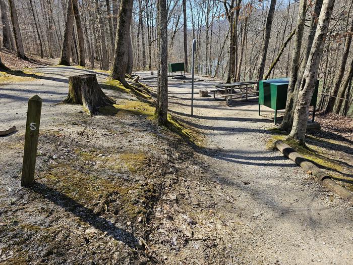 Campsite sits alongside a gravel trail.Campsite 5