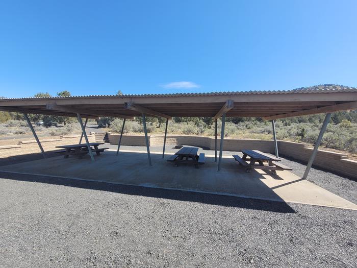 Picnic shelter with tables and fire ring Ampitheater Picnic shelter with tables, tent space, and fire ring Ampitheater 