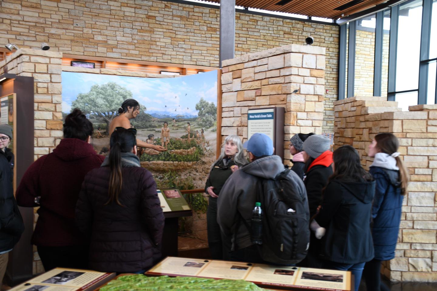 Students Explore ExhibitsStudents listen to a ranger talk about mesa top living.