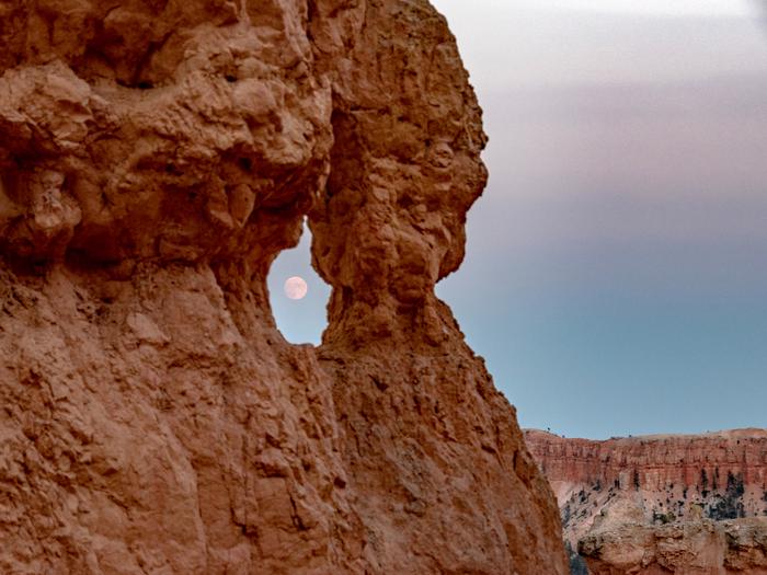 Full moon through rock window at Bryce Canyon National ParkFull moon hike at Bryce