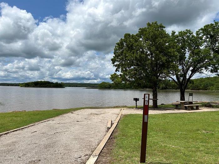 A photo of Site 7 of Loop  at Sunset Bay with Boat Ramp, Picnic Table, Fire Pit, Shade, Tent Pad, Waterfront, Lantern PoleSite 7 sits waterfront to Heyburn Lake with accessibility to the shoreline.