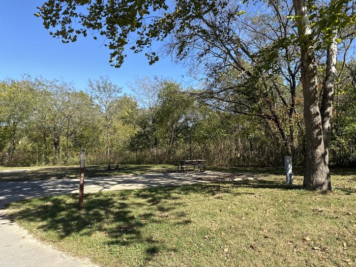 A photo of Site 615 of Loop Loop 600 at ALLEY SPRING with Picnic Table, Electricity Hookup, Fire Pit, Shade, Lantern Pole, Water Hookup