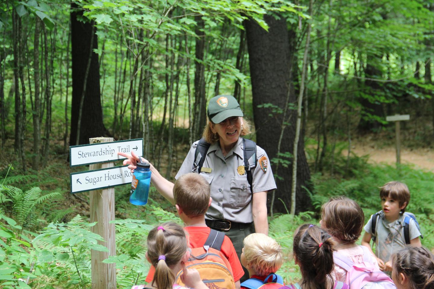 Fun in the Forest campPark Ranger Marie teaching kids about trail stewardship