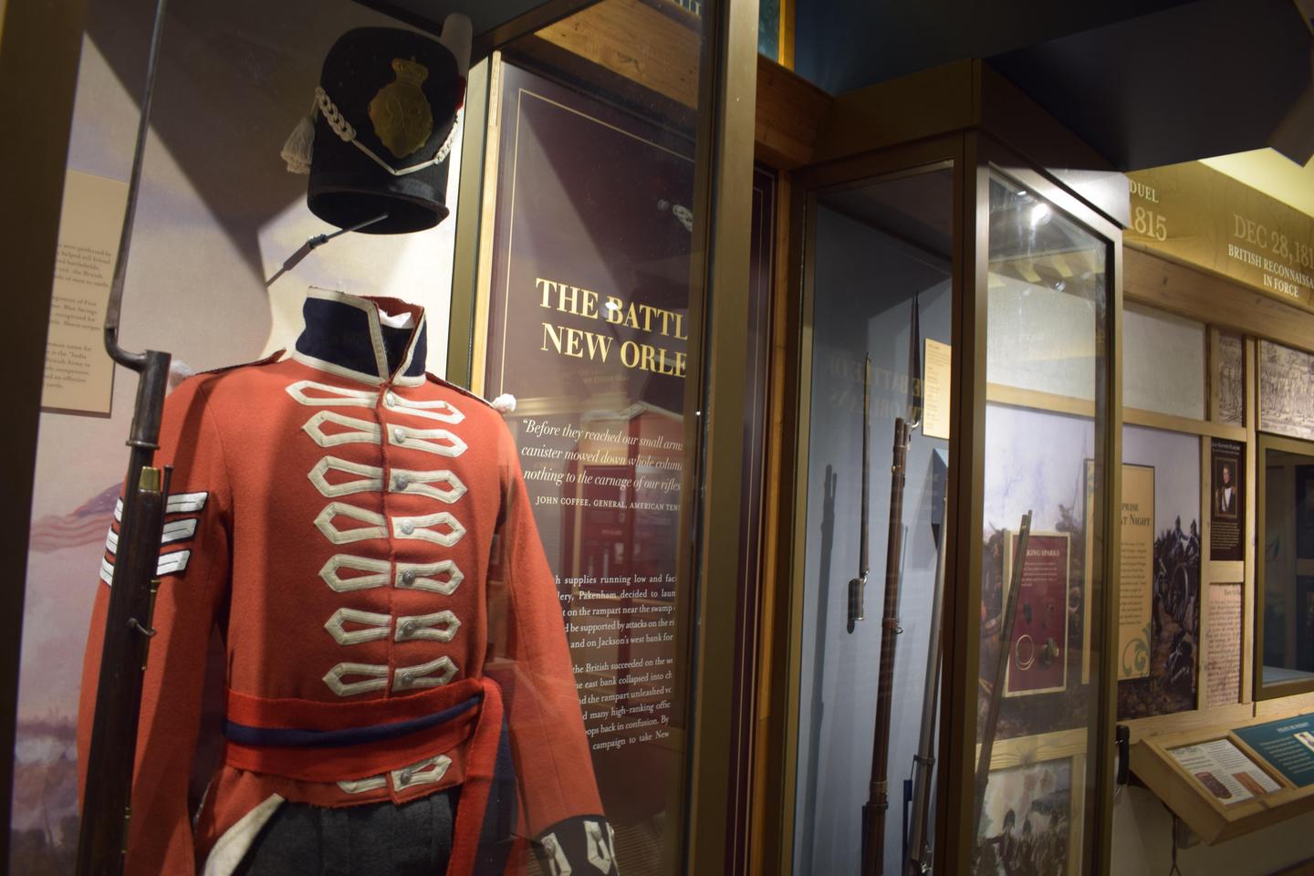 Museum ExhibitsA British uniform and historic weapons in display cases.