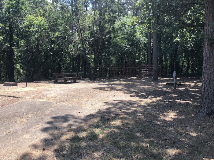 A photo of Site E002 of Loop HCLE at CEDAR LAKE (OKLAHOMA) with Picnic Table, Electricity Hookup, Shade, Lantern Pole