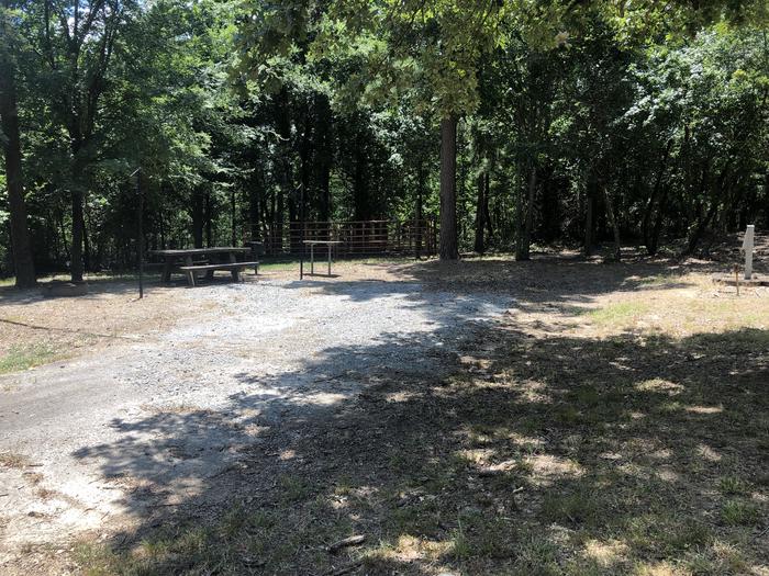 A photo of Site E003 of Loop HCLE at CEDAR LAKE (OKLAHOMA) with Picnic Table, Electricity Hookup, Fire Pit, Shade, Lantern Pole, Water Hookup