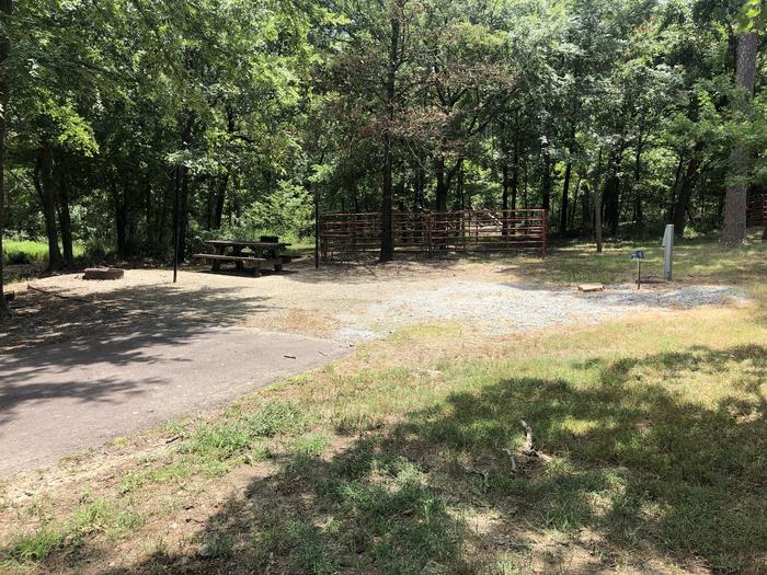 A photo of Site E005 of Loop HCLE at CEDAR LAKE (OKLAHOMA) with Picnic Table, Electricity Hookup, Shade, Lantern Pole, Water Hookup, Horse Pen