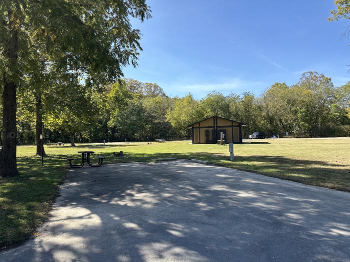 A photo of Site 618 of Loop Loop 600 at ALLEY SPRING with Picnic Table, Electricity Hookup, Fire Pit, Shade, Lantern Pole, Water Hookup