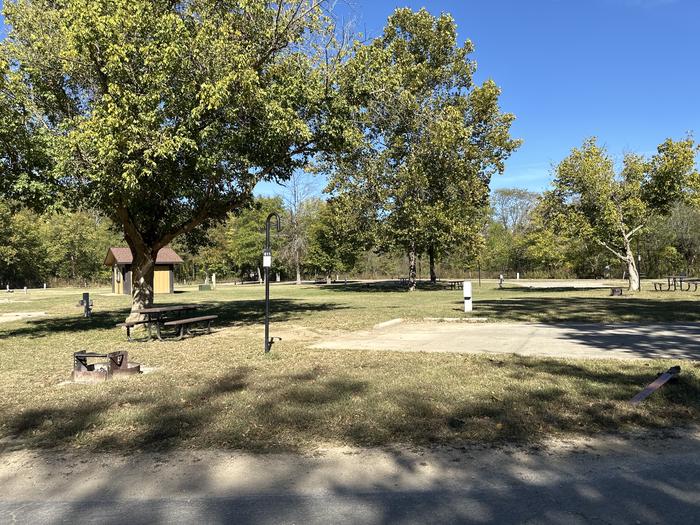 A photo of Site 611 of Loop Loop 600 at ALLEY SPRING with Picnic Table, Electricity Hookup, Fire Pit, Shade, Lantern Pole, Water Hookup