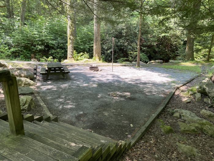 Site 9Fire ring, lantern post, and picnic table are located in the site. This site does have stairs.