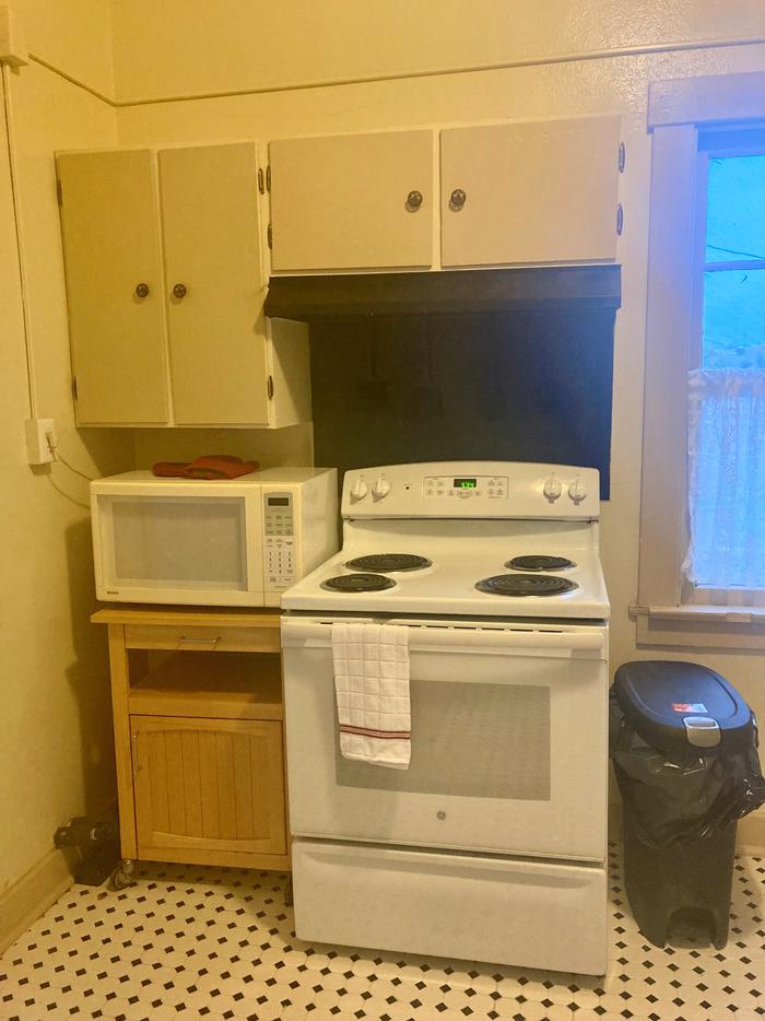 Kitchen with stove and microwave