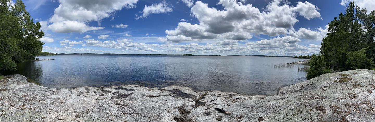 K9 - Grassy Islands South, panorama view out from the campsite of the rocky shoreline looking over the water.Panoramic View