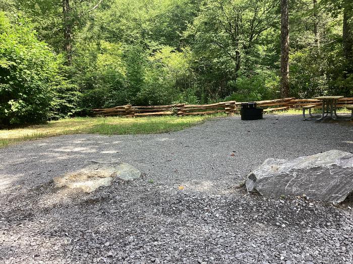 A photo of Site 006 of Loop River at BLACK MOUNTAIN CAMPGROUND with Picnic Table, Fire Pit, Shade, Tent Pad, Waterfront, Lantern Pole