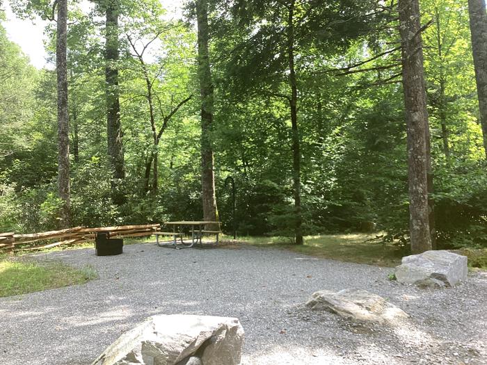 A photo of Site 006 of Loop River at BLACK MOUNTAIN CAMPGROUND with Picnic Table, Fire Pit, Tent Pad, Waterfront, Lantern Pole