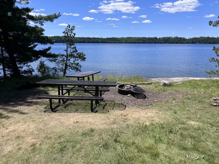 S12 - Mukooda Lake Bass campsite, view looking out over the water with a couple of picnic tables and the fire ringS12 - Mukooda Lake Bass campsite