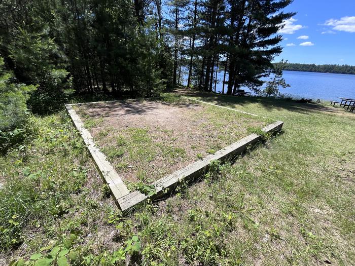 Mukooda Lake Bass campsite, tent pad #1 with water in the backgroundTent Pad #1