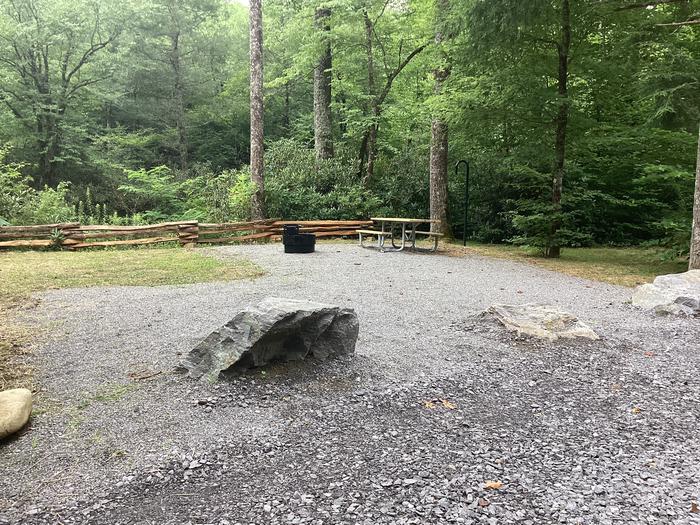 A photo of Site 006 of Loop River at BLACK MOUNTAIN CAMPGROUND with Picnic Table, Fire Pit, Shade, Waterfront, Lantern Pole