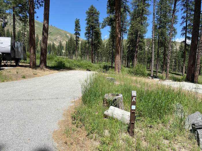 Post for site 16a in Pine flats campground shown next to a concrete trailer pad Site 16a and trailer pad in the Pine Flats campground, Boise National Forest 