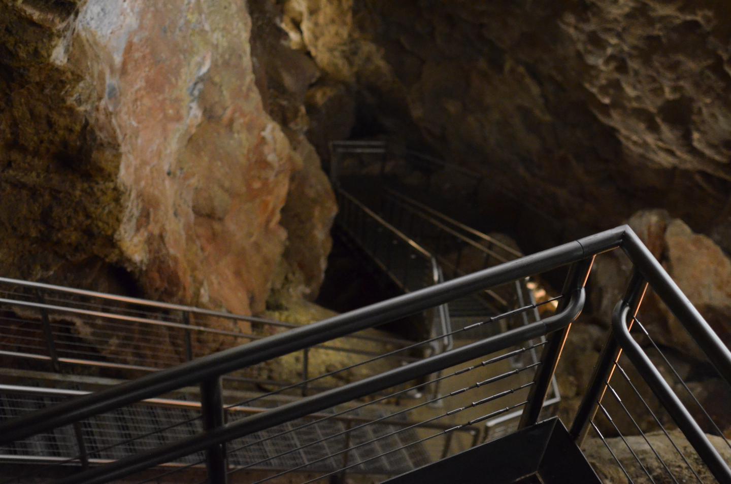 Stairs continuing downward inside a cave.The Scenic Tour is approximately 1/2 mile with over 700 steps and takes about 80 minutes.