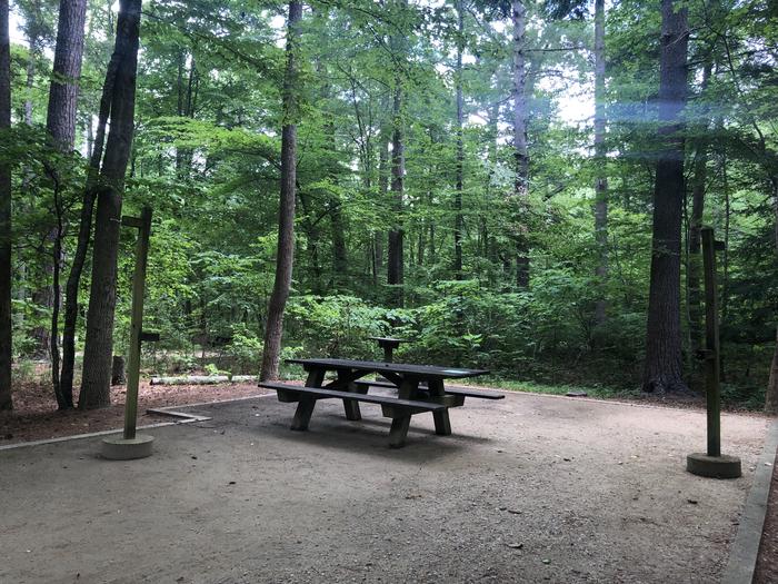 A photo of Site 015 of Loop CAVE MOUNTAIN LAKE FAMILY CAMP at CAVE MOUNTAIN LAKE FAMILY CAMP with Picnic Table, Fire Pit, Lantern Pole