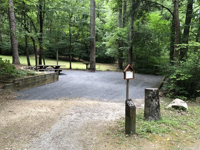 A photo of Site 039 of Loop B at CAVE MOUNTAIN LAKE FAMILY CAMP with Picnic Table, Fire Pit, Shade, Tent Pad, Lantern Pole