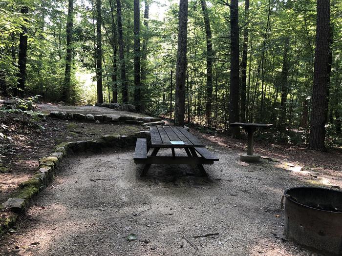 A photo of Site 034 of Loop B at CAVE MOUNTAIN LAKE FAMILY CAMP with Picnic Table, Fire Pit