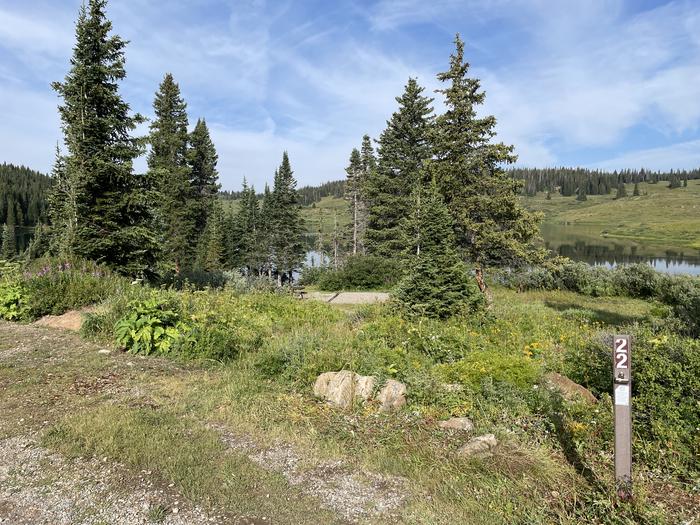 A photo of Site 22 at Deep Lake Campground with Picnic Table, Tent Pad.