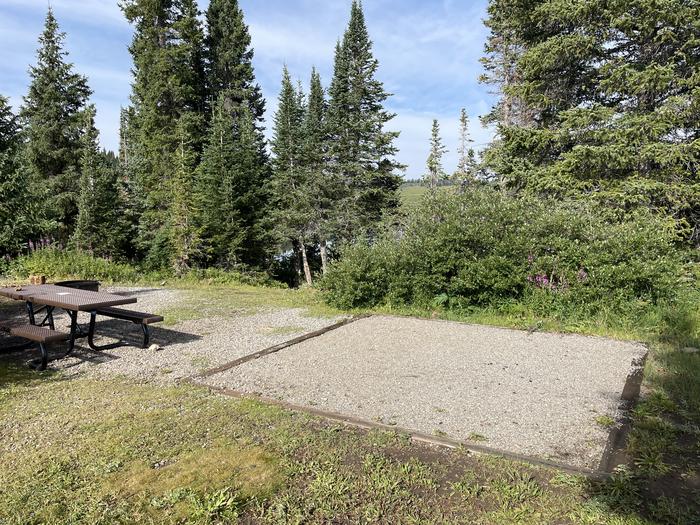 A photo of Site 22 at Deep Lake Campground with Picnic Table, Fire Pit, Shade, Tent Pad.