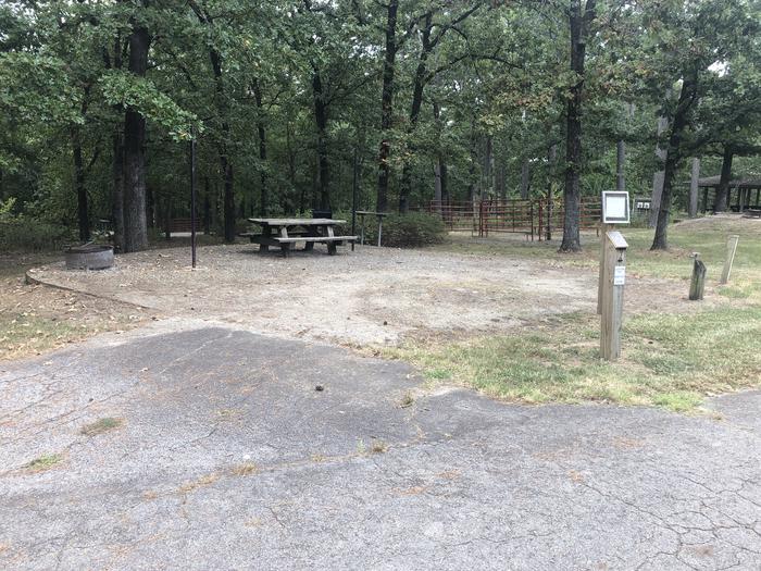 A photo of Site 010 of Loop HCMR at CEDAR LAKE (OKLAHOMA) with Picnic Table, Fire Pit, Shade, Lantern Pole, Water Hookup