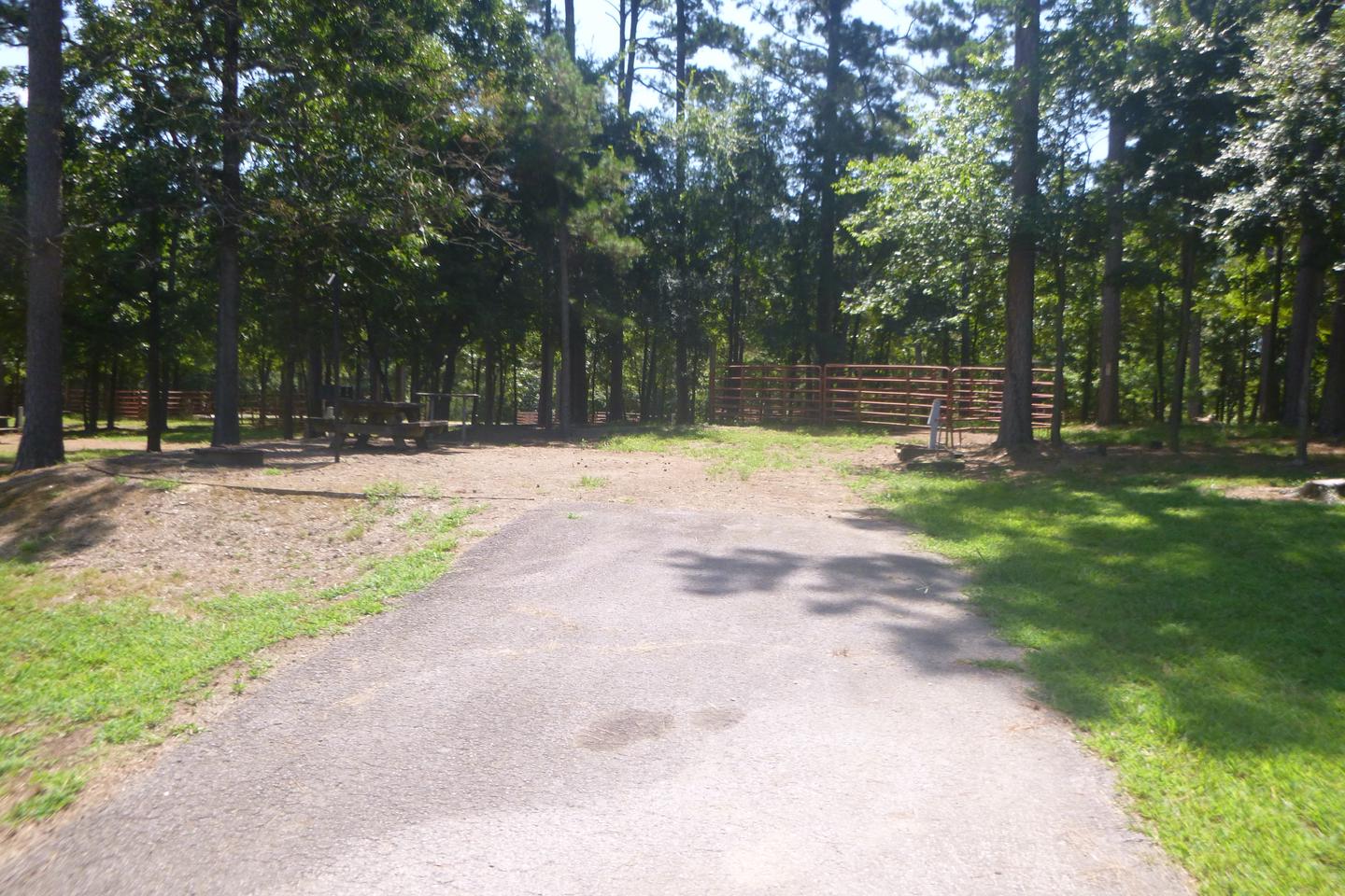 Site E14 with picnic table, fire ring, grill, water/electric hookupSite E14 with picnic table, horse pen, electric and water hookup