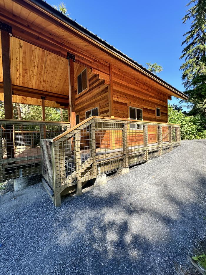 Anan Bay Cabin with entrance ramp and gateAnan Bay cabin side view showing entrance ramp