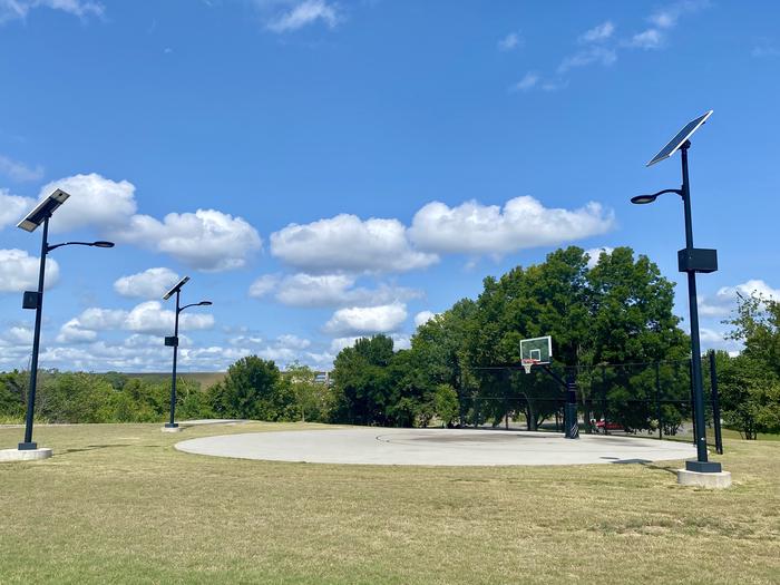 Brush Creek basketball court located at the top of the park near the fitness trail offers ample parking space, a short walk to the campgrounds, and light post for late night games.A photo of facility at Brush Creek Public Use Area. 