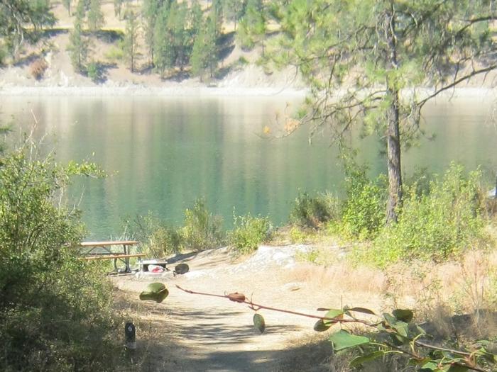 Site 9. Walk in. Trees and lake in the background.