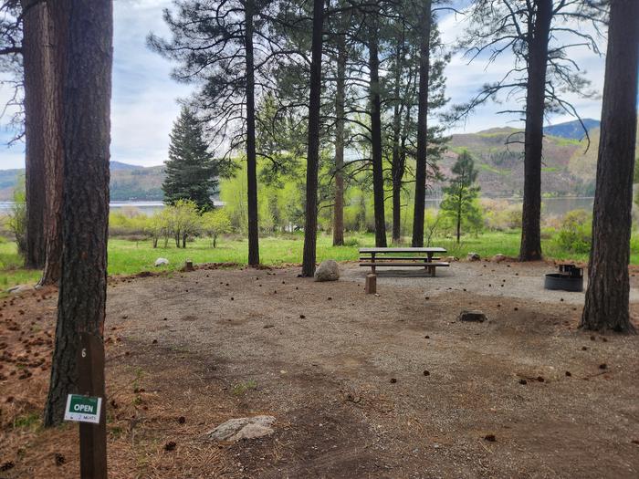 Site 6 near lake with picnic table and fire ring