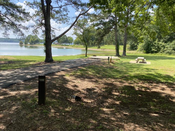 A photo of Site 108 of Loop LOOG at R SHAEFER HEARD with Picnic Table, Electricity Hookup, Fire Pit, Shade, Tent Pad, Waterfront, Lantern Pole, Water Hookup