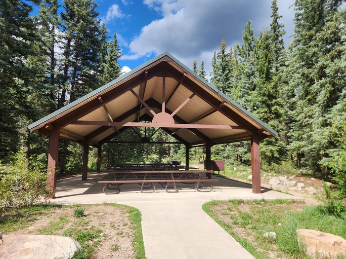 Pavilion area with picnic tables, grills, fire pit, and bear boxes