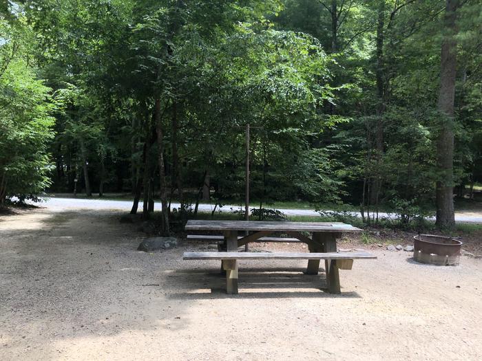 A photo of Site 026 of Loop CAVE MOUNTAIN LAKE FAMILY CAMP at CAVE MOUNTAIN LAKE FAMILY CAMP with Picnic Table, Fire Pit, Lantern Pole