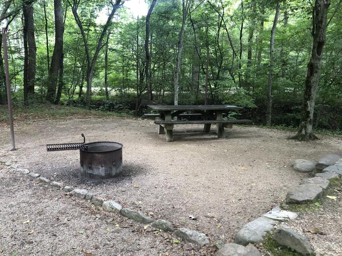 A photo of Site 002 of Loop CAVE MOUNTAIN LAKE FAMILY CAMP at CAVE MOUNTAIN LAKE FAMILY CAMP with Picnic Table, Fire Pit, Lantern Pole