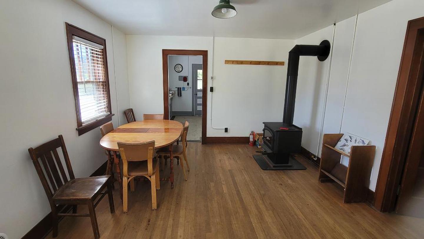 A photo of the dining area and wood stove at the Buckhorn Ranger cabin.  