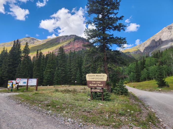 Entrance sign to South Mineral Campground with a mountain in the background