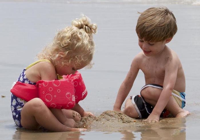 Sands of Cape HatterasTwo kids enjoy the sands of Cape Hatteras National Seashore.