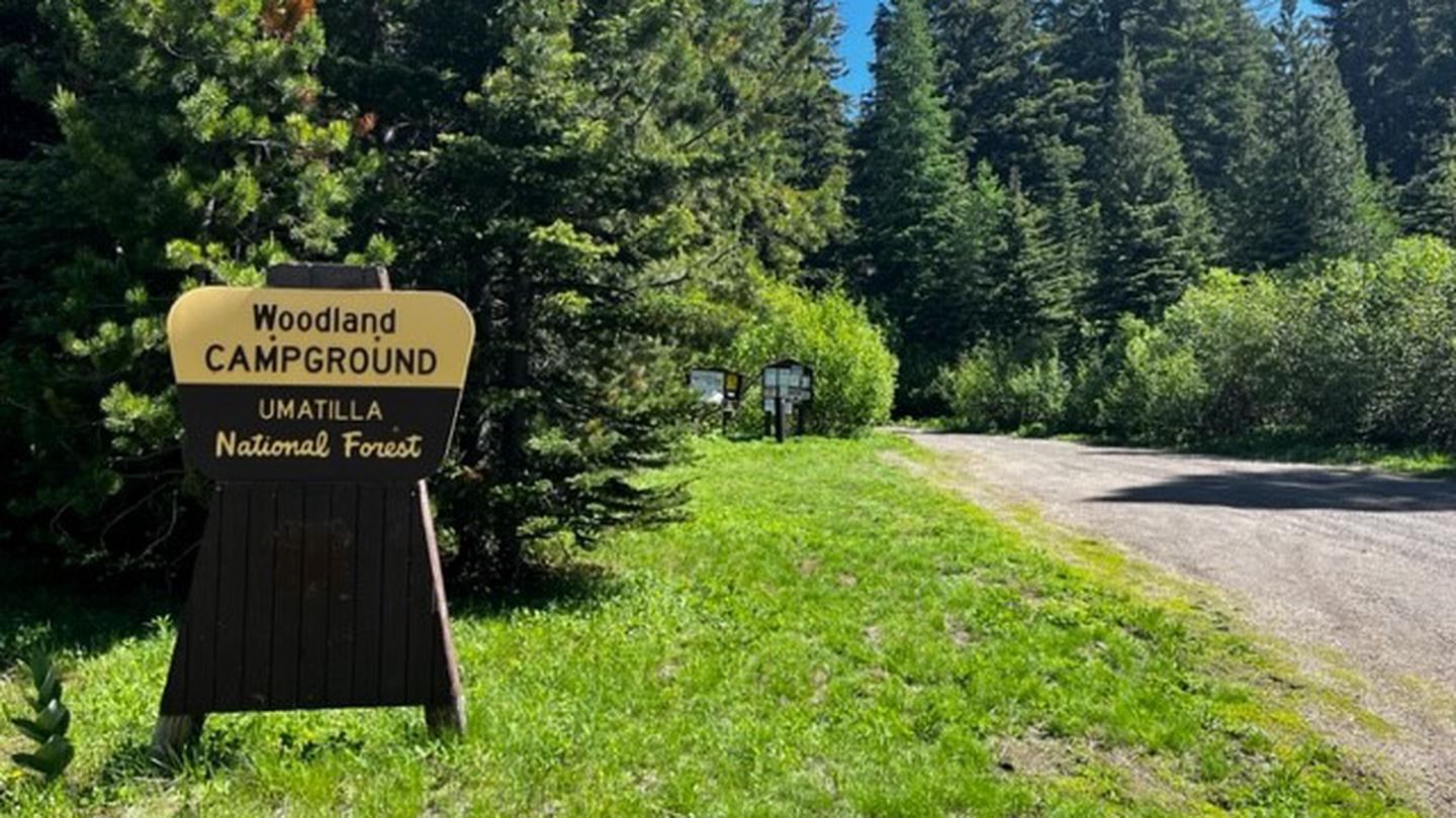 Entrance sign reading "Woodland CAMPGROUND UMATILLA National Forest"Woodland Entrance Sign