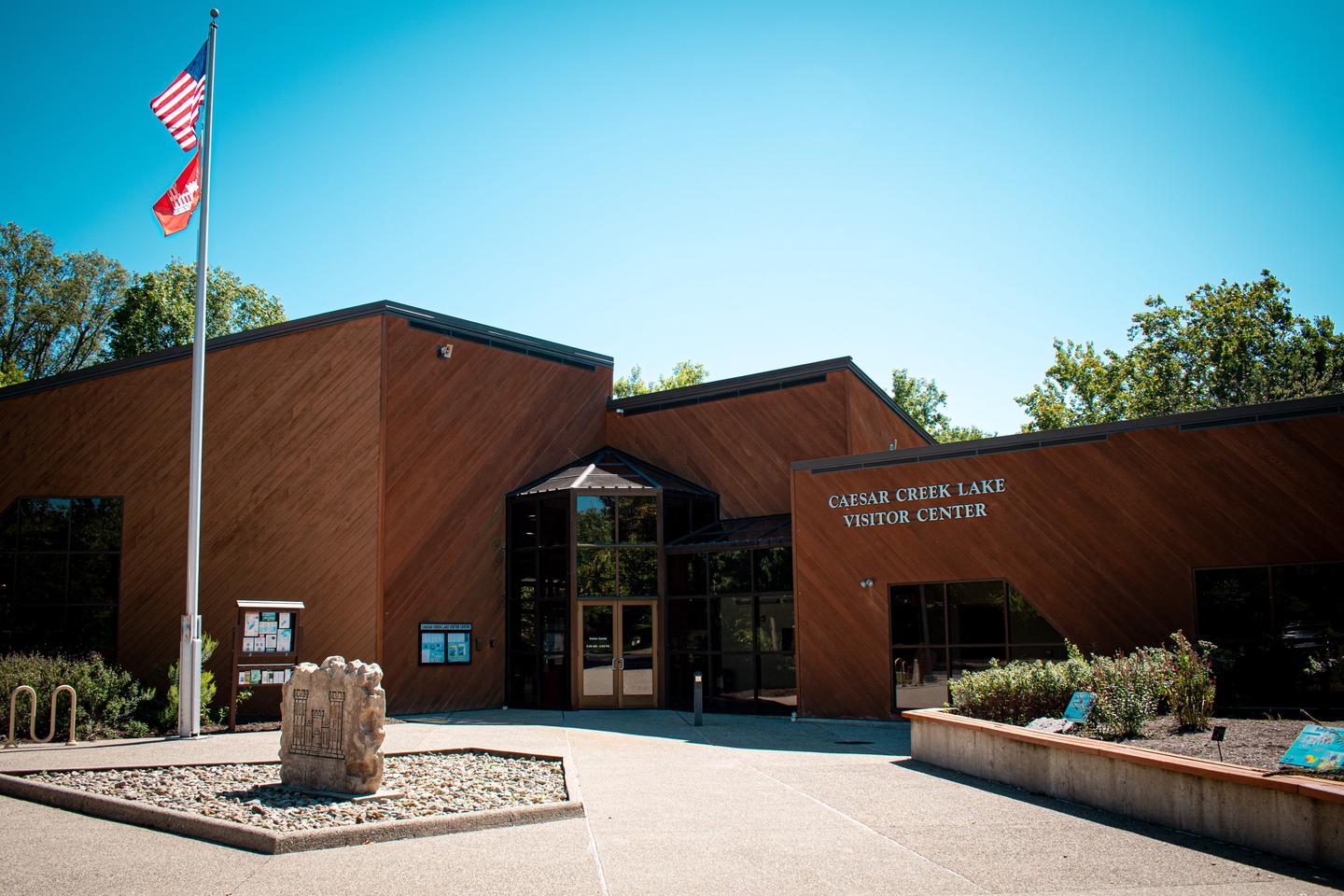 Visitor Center with flag and blue skiesCaesar Creek Visitor Center