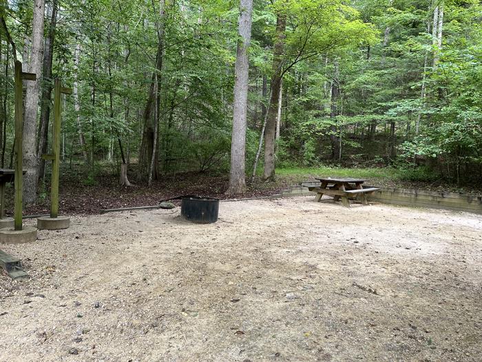 A photo of Site 025 of Loop CAVE MOUNTAIN LAKE FAMILY CAMP at CAVE MOUNTAIN LAKE FAMILY CAMP with Picnic Table, Fire Pit, Lantern Pole