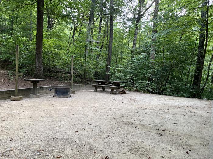 A photo of Site 033 of Loop B at CAVE MOUNTAIN LAKE FAMILY CAMP with Picnic Table, Fire Pit, Tent Pad, Lantern Pole