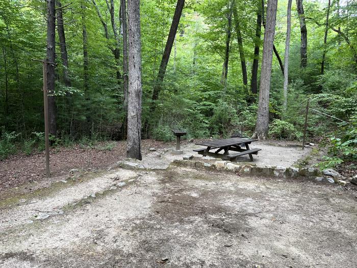 A photo of Site 034 of Loop B at CAVE MOUNTAIN LAKE FAMILY CAMP with Picnic Table, Shade, Tent Pad